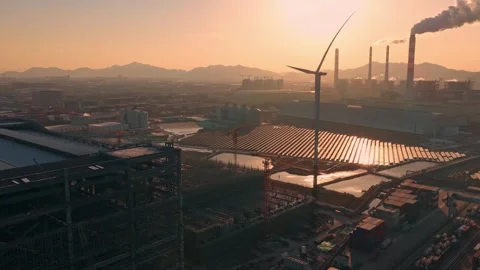 Wind turbine, solar panel power plant. Renewable eco energy factory at port. 库存影片 334115047