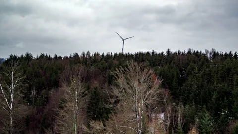 Wind turbine spinning in front of forest in winter 4 스톡 동영상 147316701