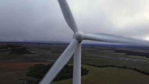 Wind Turbine Spinning Under Cloudy Sky – Renewable Energy Concept Stock Footage 324624258