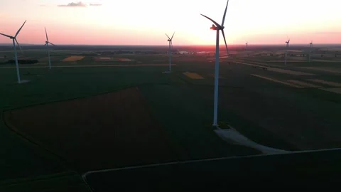Wind turbine at sunset in bright red Stock Footage 243720191
