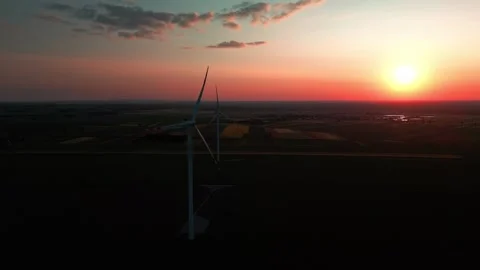 Wind turbine at sunset in bright red Video stock 243720336
