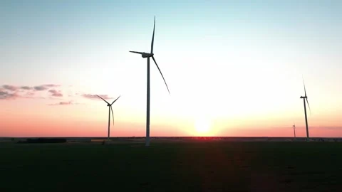 Wind turbine at sunset in bright red Stock Footage 243750513