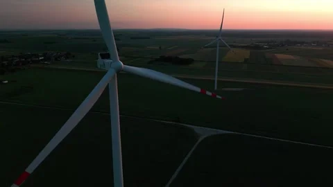 Wind turbine at sunset in bright red Stock Footage 243751522