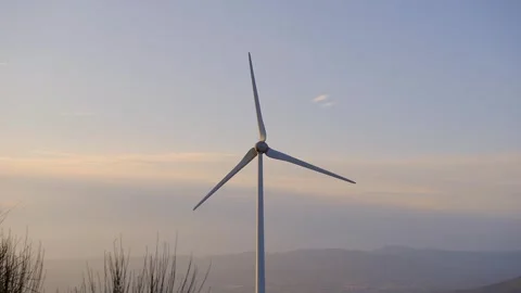 Wind turbine at sunset Видео 252081799