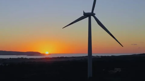 Wind turbine at sunset Stock Footage 277682637