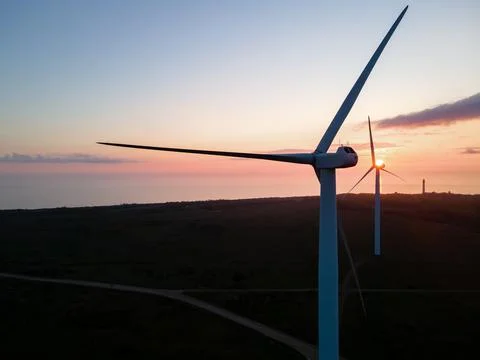 Wind turbine on sunset Stock Photos
