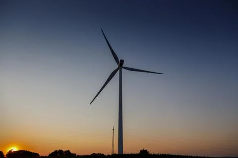 Wind turbine at sunset Stock Photos