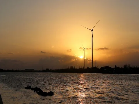 Wind turbine on sunset sky background Stock-Footage 73720536
