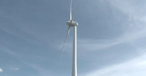 Wind Turbine - Tilt down to Locked Gate - 4k Stock Footage 74362460