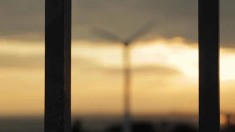 Wind Turbine Turning at Sunset Stock Footage 112949147