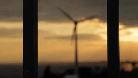 Wind Turbine Turning at Sunset Stock Footage 112949449