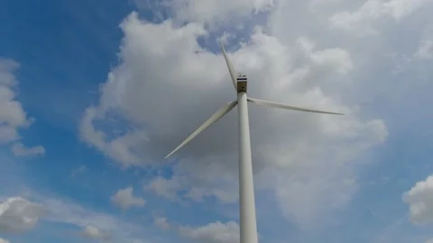 Wind turbine windmill with blades producing clean alternative renewable energ Stock Footage 157574067