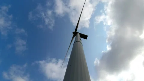 Wind turbine windmill with blades producing clean alternative renewable energ Stock Footage 163603186