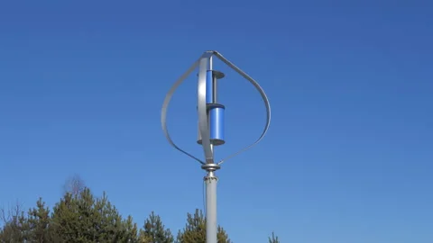 Wind turbine is working on the blue sky background. Alternative energy source. Video stock 148238418