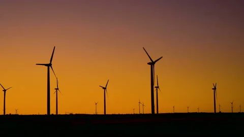 Wind turbines in action generating eco energy at sunset. Stock Footage 137523713
