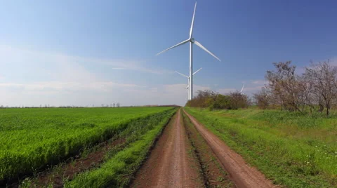 Wind turbines against blue sky Stock Footage 63263628