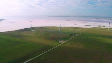 Wind turbines among green fields. Aerial view. Green energy concept. Stock Footage 158212823