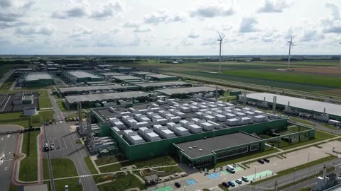Wind Turbines and Eemshaven Data Center Shot by Drone 動画素材 314442201