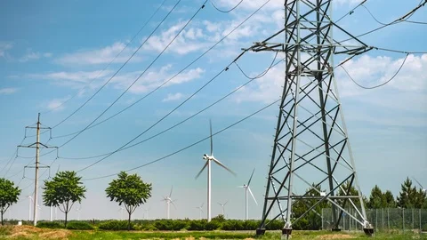 Wind turbines and high voltage power lines. Beautiful summer landscape. Time Video stock 111919786