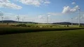 Wind turbines and maize fields farmland landscape drone shot sunny day 4k or 4k+ Resolution