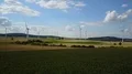 Wind turbines and maize fields farmland landscape drone shot sunny day 4k or 4k+ Resolution