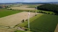 Wind turbines and maize fields farmland landscape drone shot sunny day 4k or 4k+ Resolution
