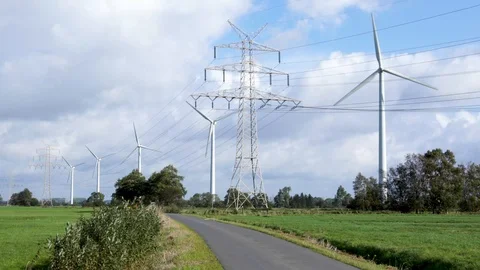 Wind turbines and power lines in rural landscape Stock Footage 118445889