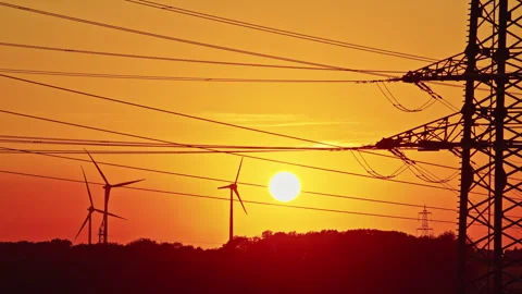 Wind Turbines and Power Lines at Sunset Stock Footage 344564520