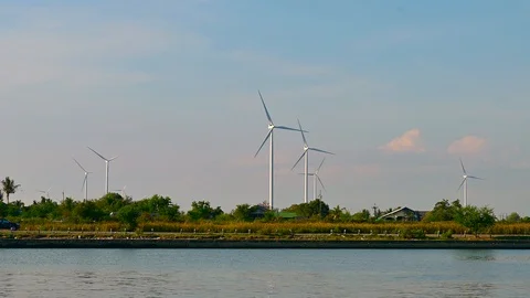 Wind turbines are spinning during the setting sun. video Time Lapse 4K Stock Footage 116620566