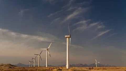 Wind turbines on a background of blue sky with clouds. Timelapse Stock Footage 71089159