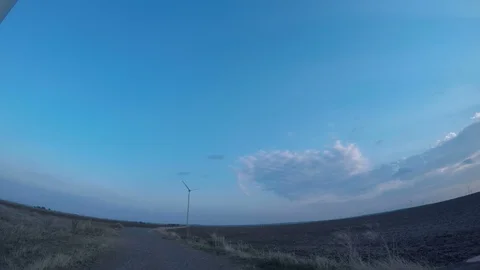 Wind Turbines in the background at sunset scene Stock Footage 106866417