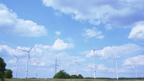 Wind turbines on barren field in August 스톡 동영상 203917469