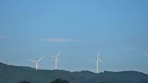 Wind Turbines Beneath a Clear Blue Sky Stock Footage 306636732