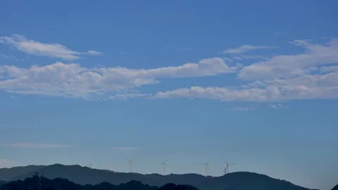 Wind Turbines Beneath a Clear Blue Sky Stock Footage 306636733