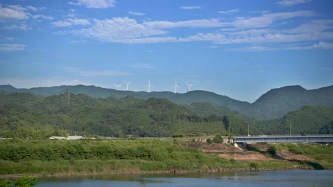 Wind Turbines Beneath a Clear Blue Sky Stock Footage 306636736