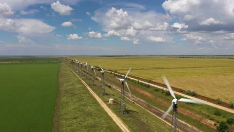 Wind turbines between the wheat fields against the cloudy thunder sky Stock Footage 165226231