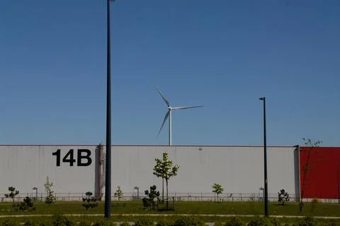 Wind turbines on a blue sky background Stock Photos