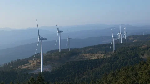 Wind Turbines Casting Shadows on a Mountain in a Morning (Realtime | Zoom In) Stock Footage 236929879