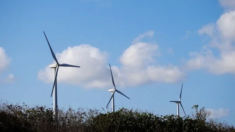 Wind turbines close up with clouds in the background Video stock 124635968