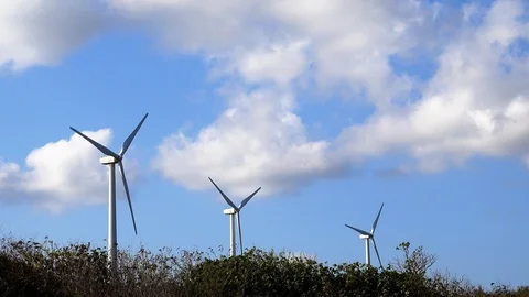 Wind turbines close up with clouds in the background Vídeo Stock 124641541