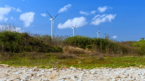 Wind turbines close up with clouds in the background Vídeo Stock 124858060