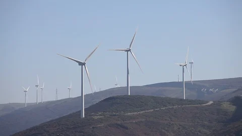Wind turbines create renewable energy. Ecology and environment concept. Stock Footage 87649372