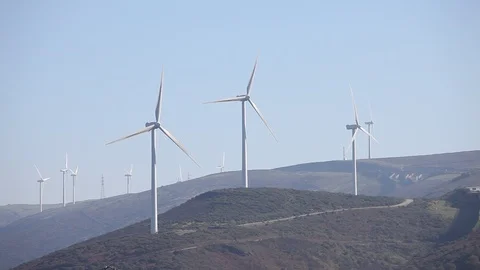 Wind turbines create renewable energy at the rural countryside landscape Video stock 87657895