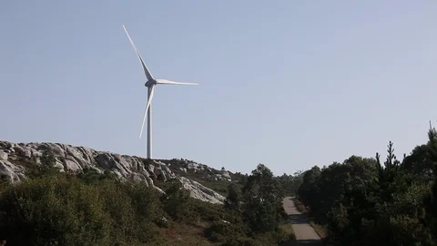 Wind turbines create renewable energy at the rural countryside landscape Video stock 87657919