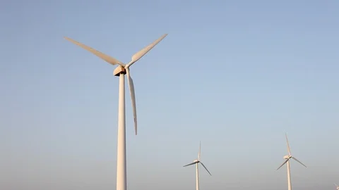 Wind turbines create renewable energy at the rural countryside landscape Video stock 87657932