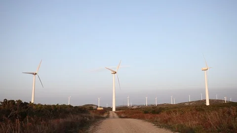 Wind turbines create renewable energy at the rural countryside landscape Video stock 87658000