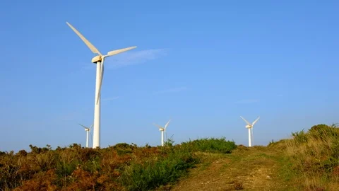 Wind turbines create renewable energy at the rural countryside landscape Video stock 88101249