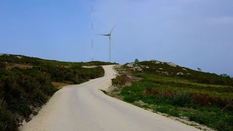 Wind turbines create renewable energy at the rural countryside landscape Video stock 88104858