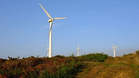 Wind turbines create renewable energy at the rural countryside landscape Video stock 88104891