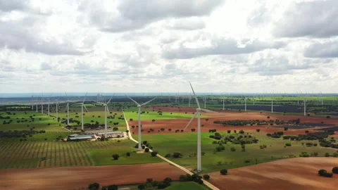 Wind Turbines Dance Gracefully in the Open Skies of Rural Landscapes Video stock 341328411